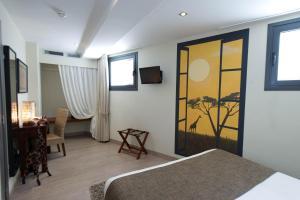 Телевизор и/или развлекательный центр в Le Petit Boutique Hotel