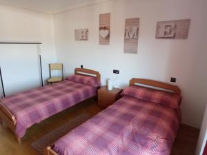A bed or beds in a room at VuT EL NEGRILLO 15 VUT-LE-413