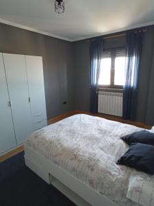 A bed or beds in a room at VuT EL NEGRILLO 15 VUT-LE-413