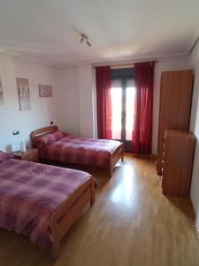 A bed or beds in a room at VuT EL NEGRILLO 15 VUT-LE-413