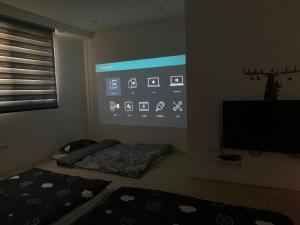 TV/Unterhaltungsangebot in der Unterkunft One Roll Stone Homestay