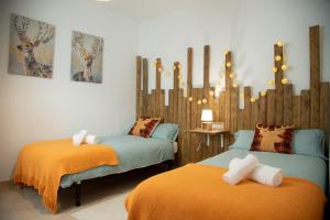 En eller flere senger på et rom på Apartament La Cabanera
