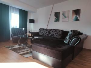 a living room with a couch and a table at Antoni Apartment in Skopje
