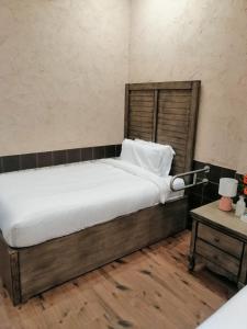 A bed or beds in a room at سيبار للشقق المخدومة Sippar Serviced Apartments