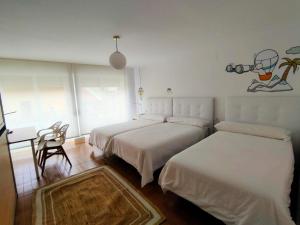 Postel nebo postele na pokoji v ubytování Hostal Pozo
