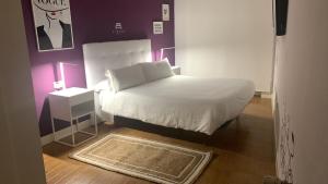 Postel nebo postele na pokoji v ubytování Hostal Pozo