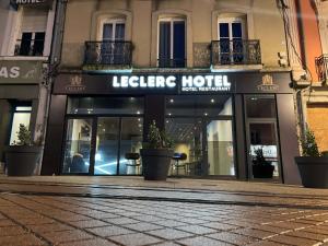 a building with a sign for a hotel at Leclerc Hotel Centre Gare in Le Mans