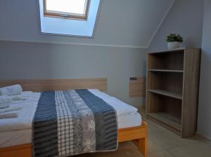 a bedroom with a bed and a window at Morskie Opowieści in Mikoszewo +99 photos