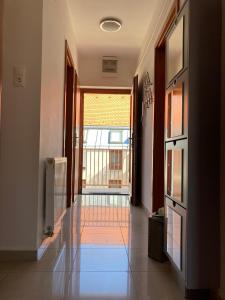 a hallway with a large window and a glass floor at Germar Apartman in Pécs