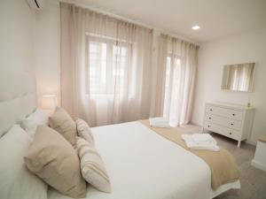 Postel nebo postele na pokoji v ubytování OPORTO GUEST Amparo Dollhouse