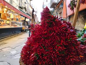 a large pile of red bananas on a street at Casa Bella in Siracusa