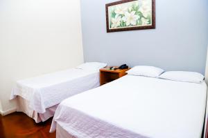 VOA Hotel Rezende客房内的一张或多张床位