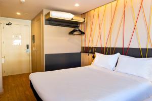 Voodi või voodid majutusasutuse ibis Styles Porto Alegre Moinhos de Vento toas