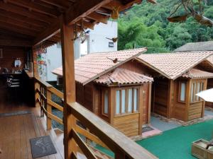 an external view of a house with a balcony at Pousada Recanto Viva a Vida in Domingos Martins +9 photos