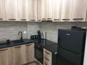 Kuchyň nebo kuchyňský kout v ubytování Apartman Magija