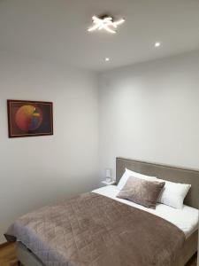 Postel nebo postele na pokoji v ubytování Apartman Magija