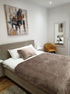 Postel nebo postele na pokoji v ubytování Apartman Magija