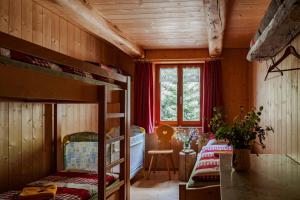 Postel nebo postele na pokoji v ubytování Rifugio Alpe San Romerio