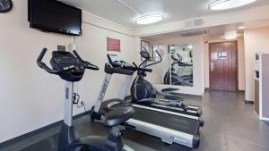 a gym with two exercise bikes and a flat screen tv at Best Western Plus Heritage Inn Rancho Cucamonga/Ontario in Rancho Cucamonga