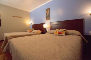 Posteľ alebo postele v izbe v ubytovaní Hospedaje Zaragoza