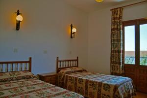Un pat sau paturi într-o cameră la Las Perdices