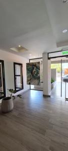 a empty room with a potted plant in the middle of it at DEPARTAMENTO AZ SUITE in Salta +42 photos