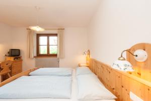 Ein Bett oder Betten in einem Zimmer der Unterkunft Residence Pichlerhof