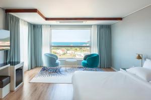 Postel nebo postele na pokoji v ubytování Hotel Sweet Castle Jeju Hamdeok