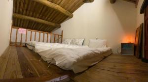 Llit o llits en una habitació de Relaxing INN Backpackers Warehouse