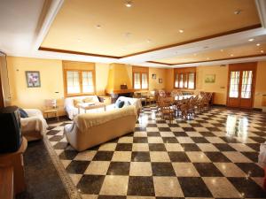 a large living room with a checkered floor at Private villa en baza in Baza