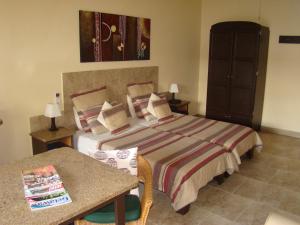 Cama o camas de una habitación en Auberge Guest Lodge