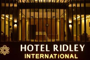 a hotelilogy international sign in front of a building at Hotel Ridley International in Digha