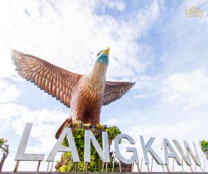 a statue of an eagle on top of a sign at Adina Homestay Langkawi ~Spacious Homestay~ in Kuah