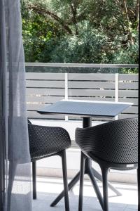 a table and two chairs sitting on a patio at Aurelia in Nikiana
