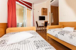 Postel nebo postele na pokoji v ubytování B&B Pansion Vago + 37 fotografií