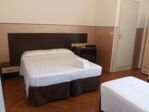 Postel nebo postele na pokoji v ubytování Hotel Liberty