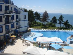 a large swimming pool next to a building at Blue Bay Palace Apart Complex in Pomorie