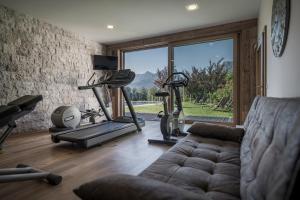 a living room with two exercise bikes and a couch at Bachmanngut in St. Wolfgang