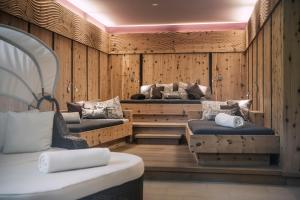 two beds in a room with wooden walls at Bachmanngut in St. Wolfgang +69 photos