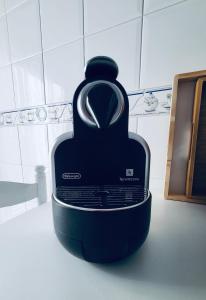 a black object sitting on the floor in a kitchen at Chiqui Home in Salamanca +15 photos