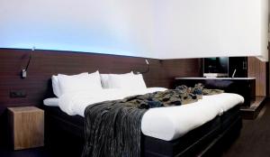 Postel nebo postele na pokoji v ubytování Carbon Hotel