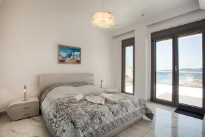 Posteľ alebo postele v izbe v ubytovaní Villa White Pearl + 32 fotografií