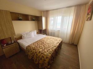 Кровать или кровати в номере Hotel Sunset Beach Vama Veche