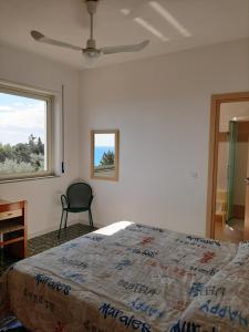 A bed or beds in a room at Hotel Conca d'Oro