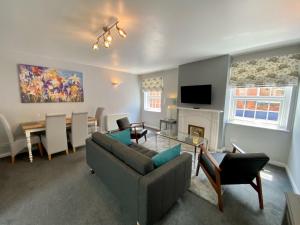 a living room with a couch and a table at The Gables in Sidmouth