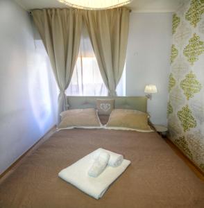 A bed or beds in a room at Sweet Home Faleria