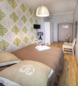 A bed or beds in a room at Sweet Home Faleria