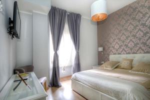 A bed or beds in a room at Sweet Home Faleria