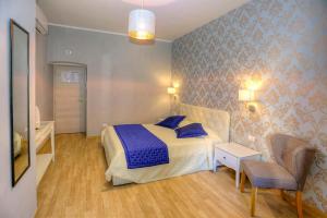 A bed or beds in a room at Sweet Home Faleria