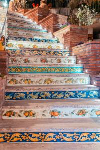 a row of stairs leading up to a staircase at Taormina Garden Hotel in Taormina